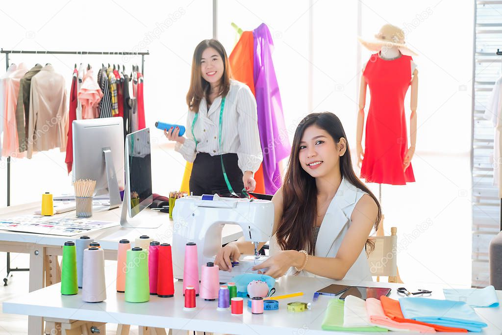 Asian women at work are fashion designers and tailors