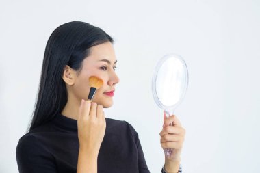 Asian businesswoman in black dress, make-up to work