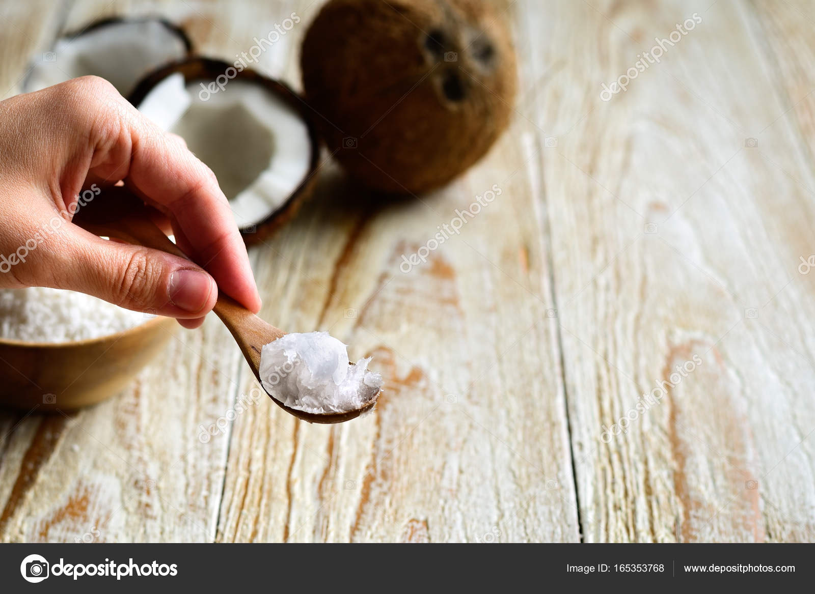 Hand Holding Spoon With Coconut Oil Stock Photo C Tataks 165353768