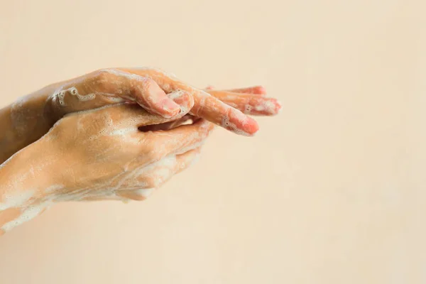 Washing hands with soap foam. Personal hygiene concept.