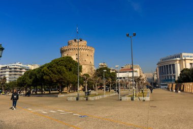 Thessaloniki, Greece - February 12 2020: White Tower, promenade in the afternoon