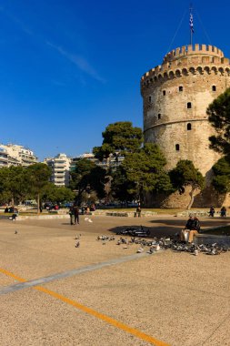 Thessaloniki, Greece - February 12 2020: White Tower, promenade in the afternoon