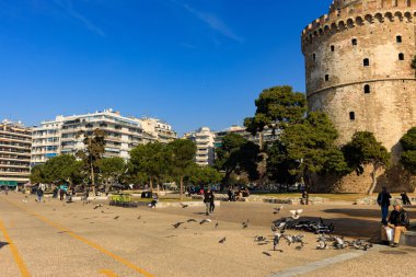 Thessaloniki, Greece - February 12 2020: White Tower, promenade in the afternoon