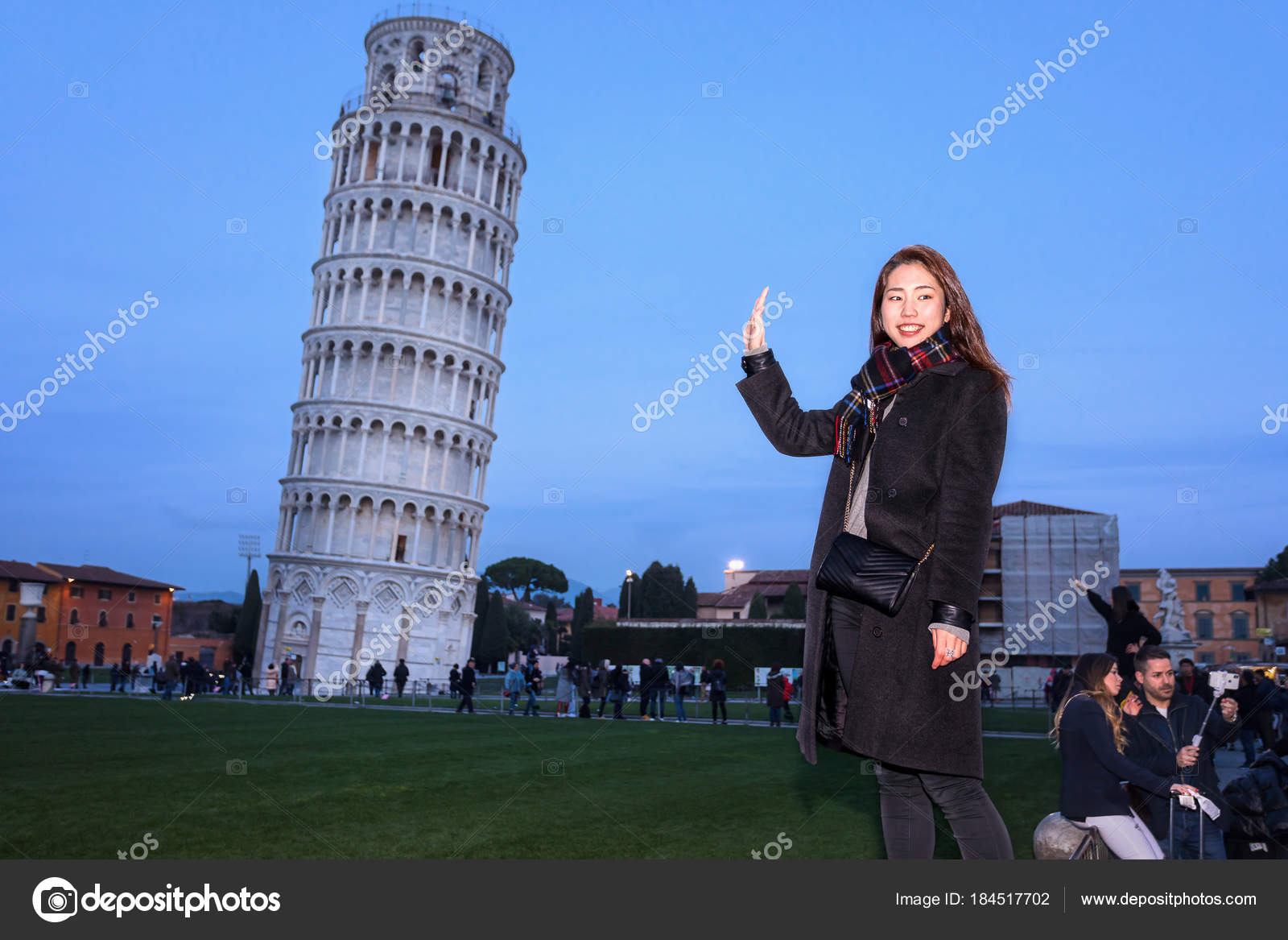 Tourists Posing In Front Of The Leaning Tower Of Pisa Editorial