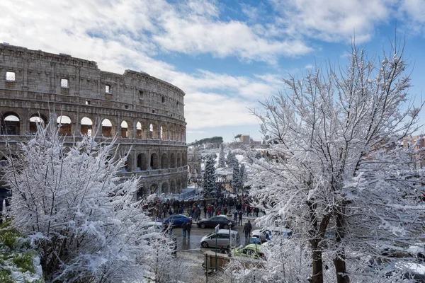 Snow covers the streets of Rome, Italy. Piazza del Colosseo come