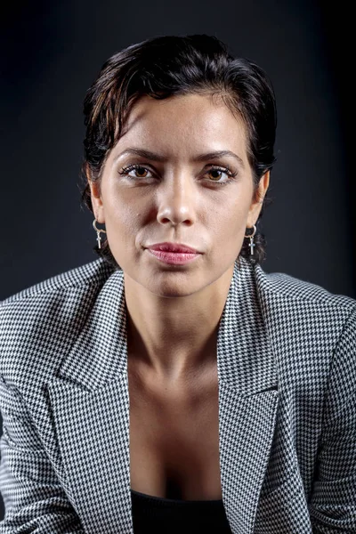 Female manager, half-length portrait on a black background