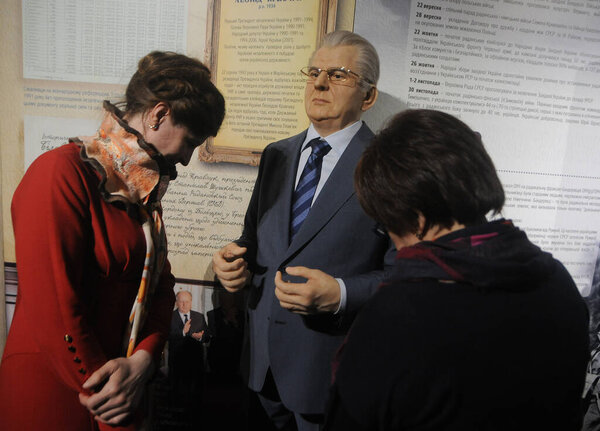 Women examine the silicone figure of the first President of Ukraine Leonid Kravchuk at the Museum of the Formation of the Ukrainian Nation, in Kiev, March 10, 2020.