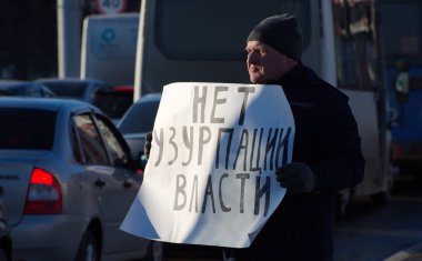 Barnaul, Russia-March 13, 2020. A man stands with a poster against Putin's policy 