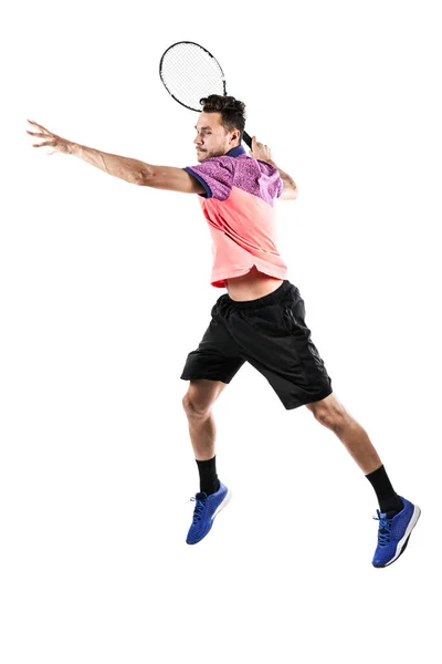 Nuori mies pelaa tennistä — kuvapankkivalokuva
