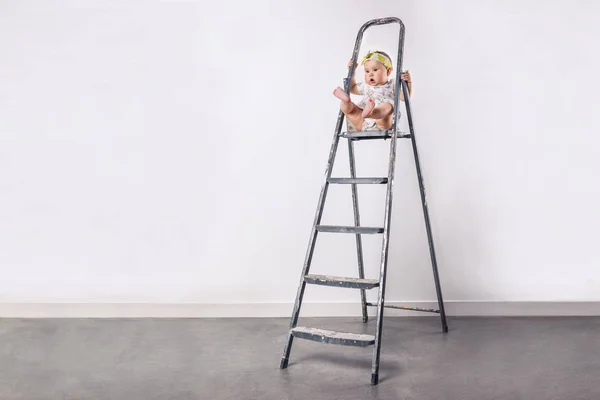 Little girl at the ladder