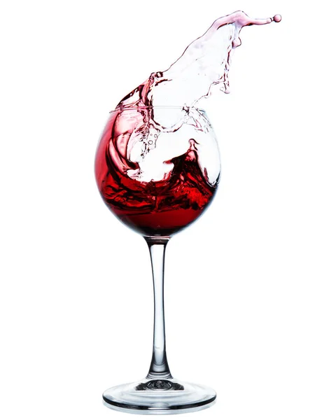 Red wine splashing in a glass — Stock Photo, Image