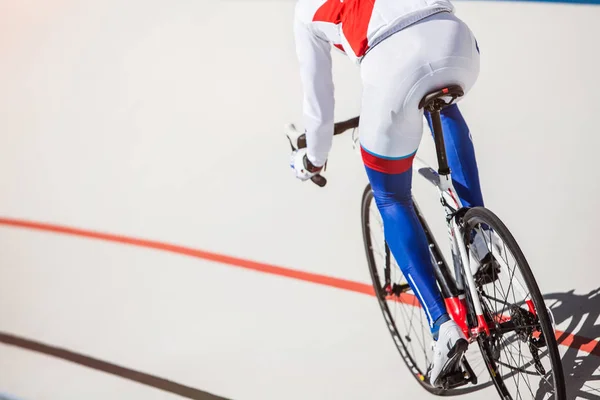 Racing cyclist on velodrome outdoor. — Stock Photo, Image