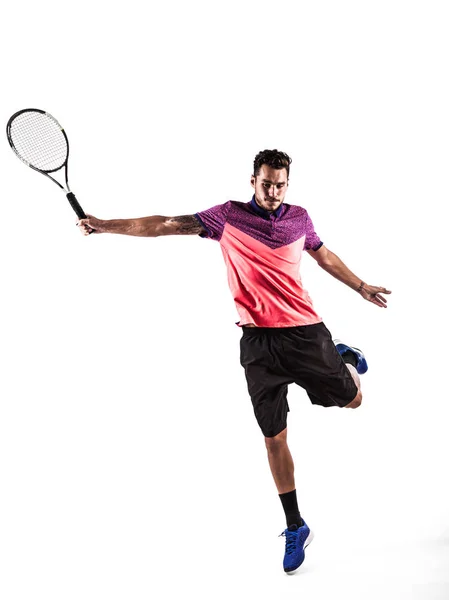 Junger Mann spielt Tennis — Stockfoto