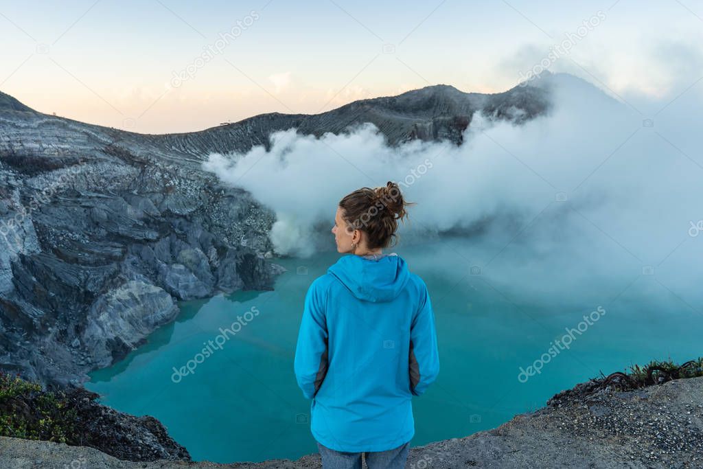 Backpacking in Asia, looking for dreamscape. Woman standing on c