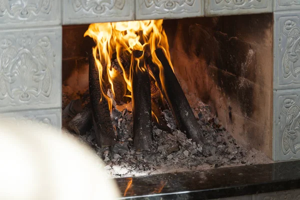 The warm mood by the fireplace — Stock Photo, Image