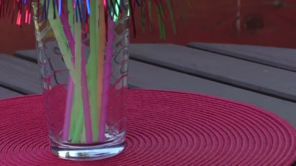 Colorful drinking straws inside a jar — Stock Video