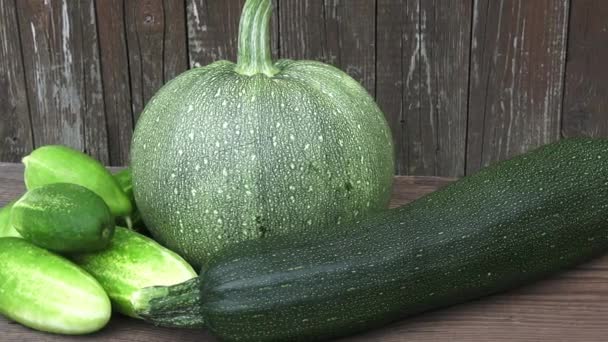 Fresh organic zucchini, cucumber and pumpkin on table — Stock Video