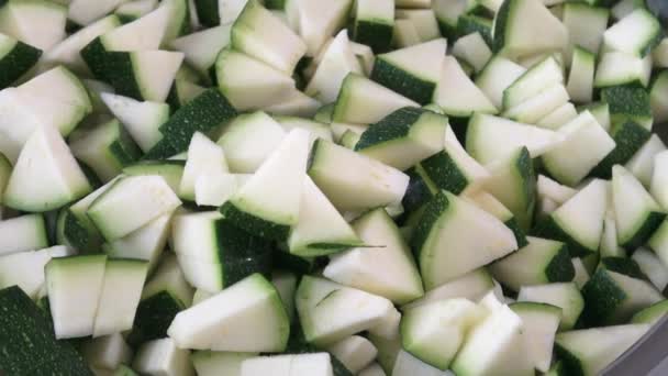 Closeup of chopped zucchini with selective focus — Stock Video