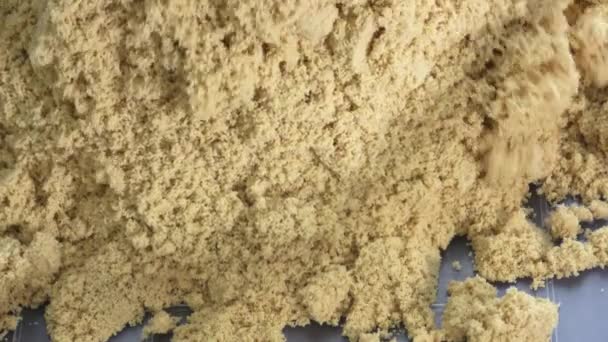 Kinetic sand close-up. Kinetic sand heap for children. — Stock Video