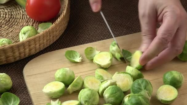 Female Hands Cutting Brussels Sprouts Wooden Board — Stock Video