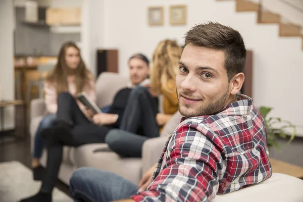 Portrait of handsome guy amongst group of friends — Stock Photo, Image