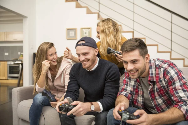 Young friends playing video games