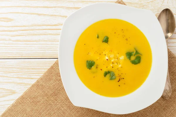 Stock image Carrot soup with feta cheese and coriander.