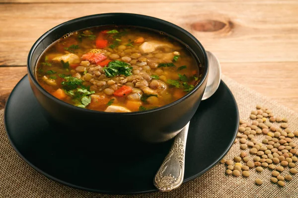 Hot soup with green lentil, chicken, vegetables and spices.