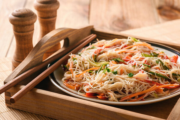 Asian salad with rice noodles and vegetables.