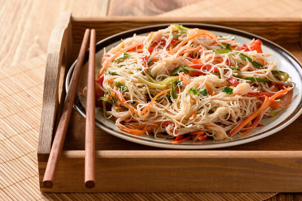 Asian salad with rice noodles and vegetables.