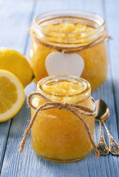 Homemade lemon jam in glass jars.