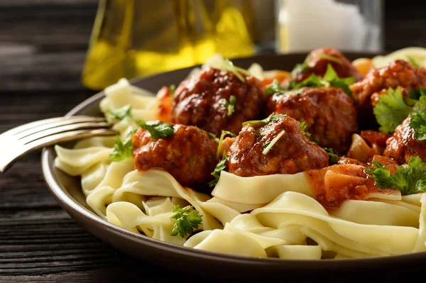 Pasta with turkey meatballs in tomato sauce. — Stock Photo, Image