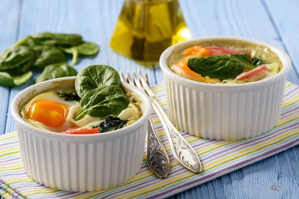 Fit food- eggs baked with spinach and tomatoes.