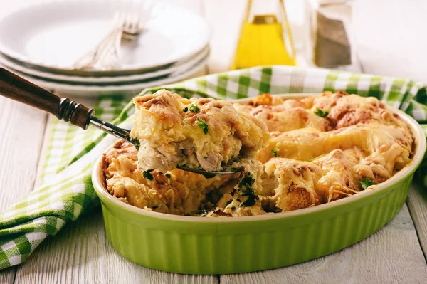 Bread casserole with chicken, spinach,eggs and cheese known as strata. — Stock Photo, Image