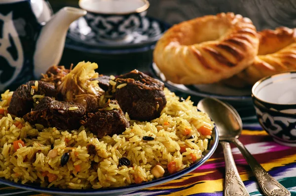 Pilaf- traditional asian dish, rice prepared with vegetables and meat. Oriental, uzbek style. — Stock Photo, Image