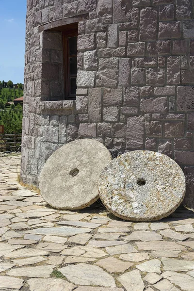 old windmill and mill grinder stone