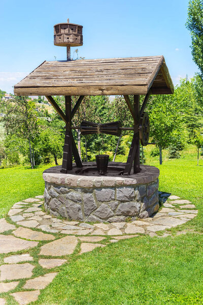 Old artesian Water Well With Pulley and Bucket