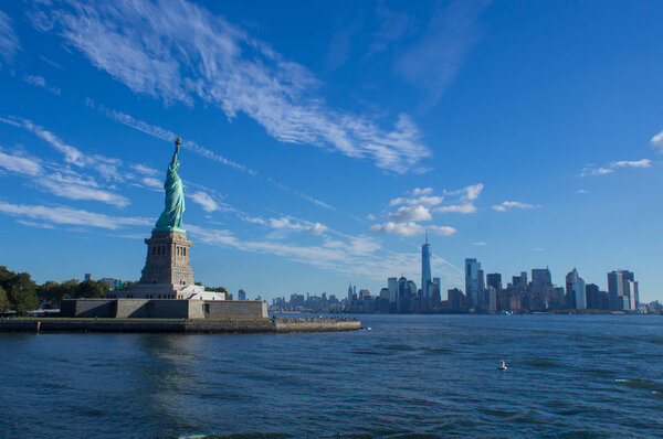 The Statue of Liberty with the skyline of New York in the background