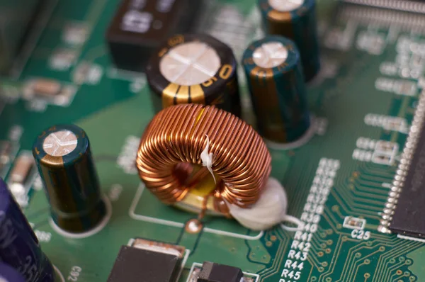 Toroidal inductor in the power supply of a wireless router.