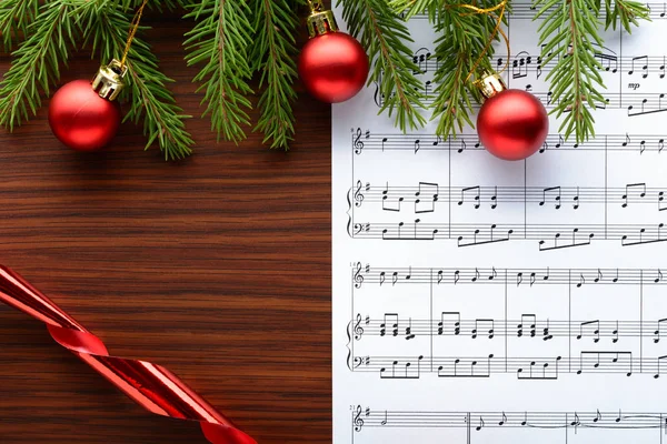 Christmas decorations on the sheets with notes — Stock Photo, Image