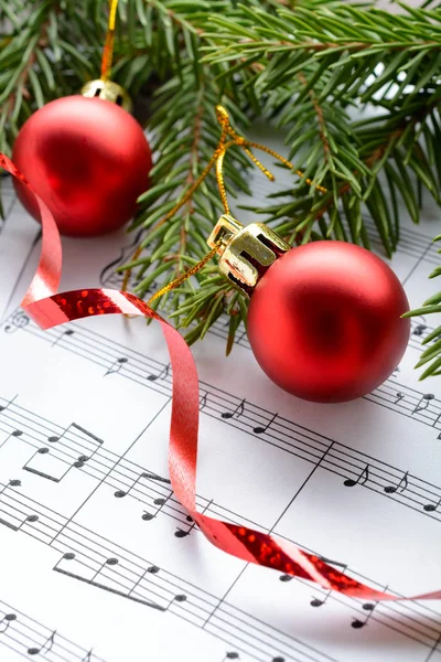 Christmas decorations on the sheets with notes — Stock Photo, Image