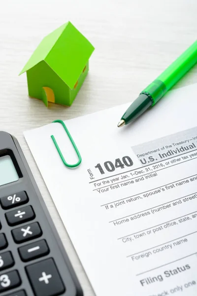 Paper house and tax form — Stock Photo, Image