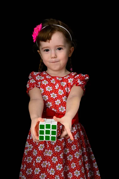 Almetyevsk City, Russia - February 7, 2017: a little girl holding a Rubik's Cube — Stock Photo, Image