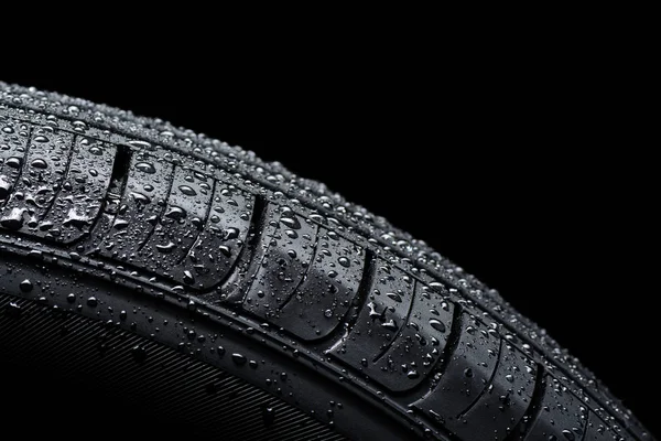 Car tire covered with water drops — Stock Photo, Image