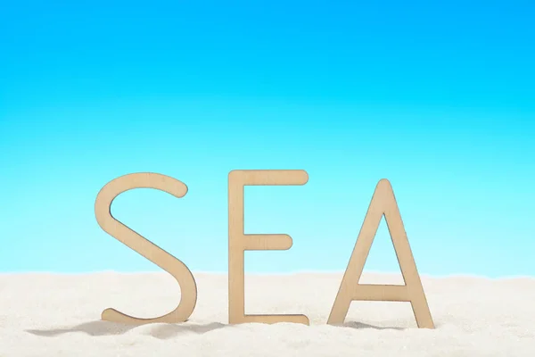 La palabra SEA en la playa — Foto de Stock