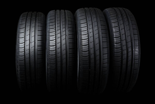 Car tires on black background