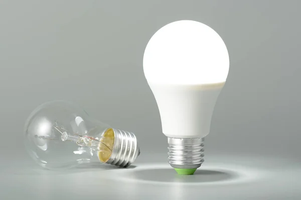 Glowing led lamp and incandescent bulb — Stock Photo, Image