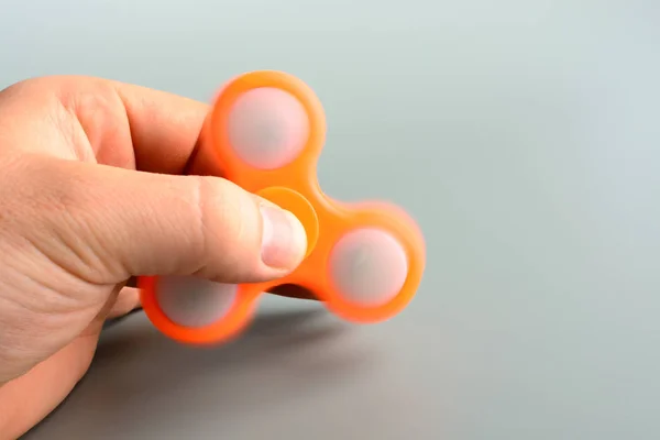 Person playing with spinner — Stock Photo, Image