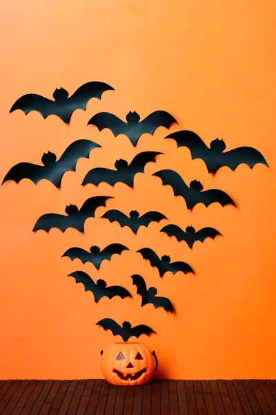 Paper bats fly out of his head Halloween pumpkin — Stock Photo, Image