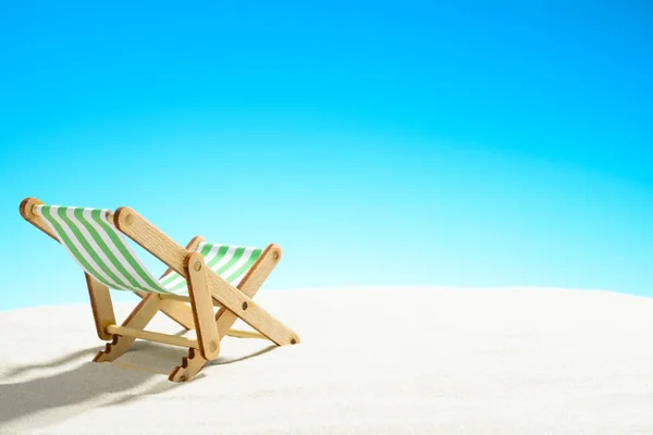 Sun lounger on the sandy beach — Stock Photo, Image